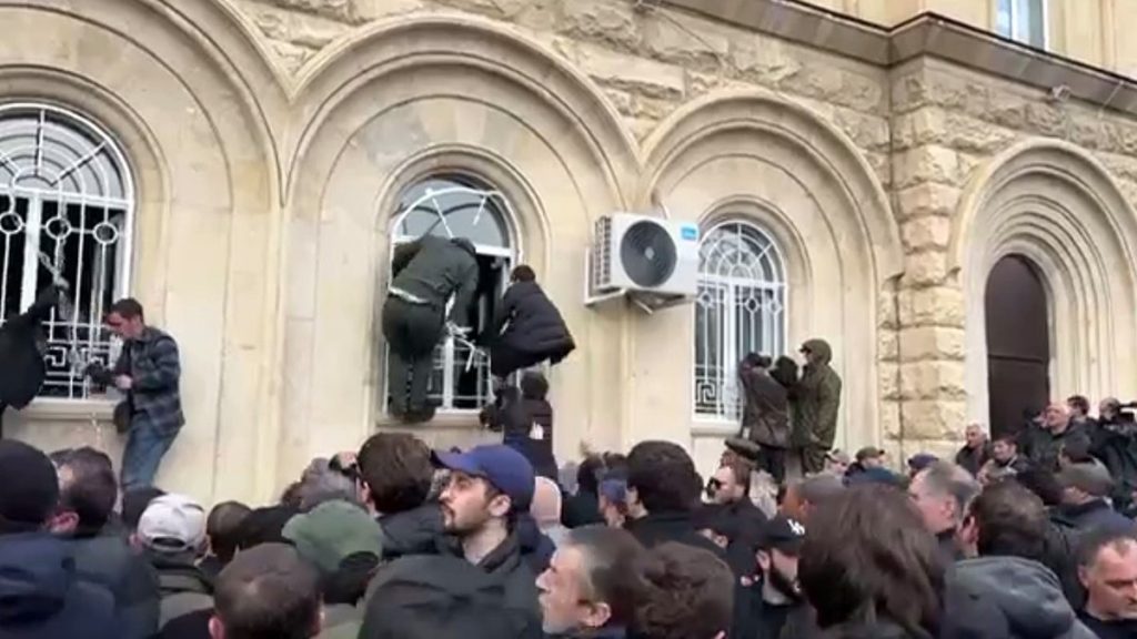 Internet InfoMedia protesters storm putin backed parliament in georgia breakaway region