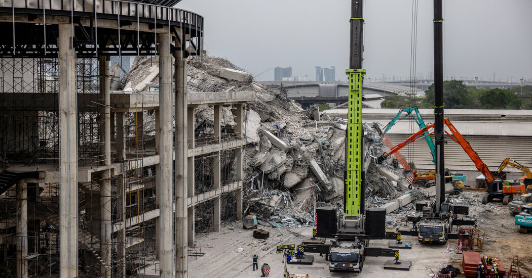 Internet InfoMedia as rescuers work at collapsed bangkok building those who found love there await news
