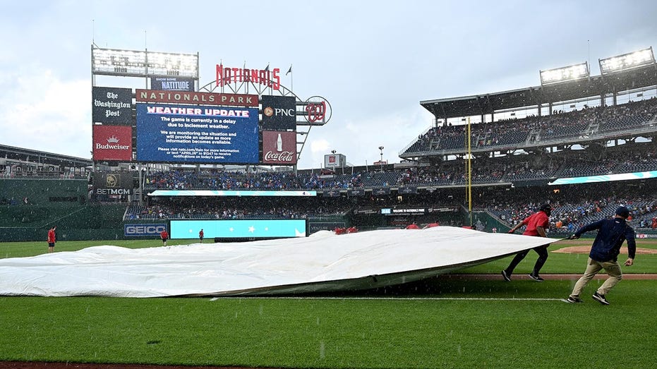 Internet InfoMedia nationals grounds crew member nearly falls victim to tarp monster during weather delay