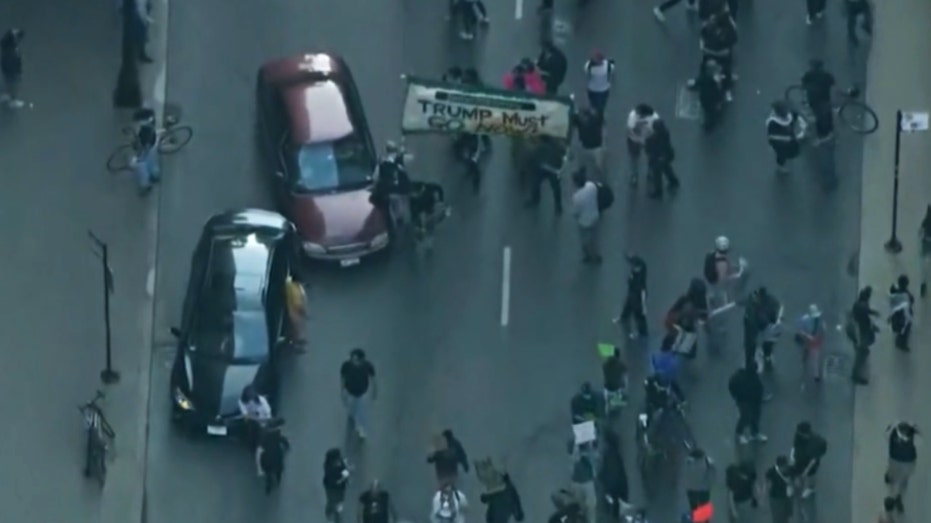 Car drives through anti-ICE protesters as Chicago joins nationwide anti-ICE unrest amid Trump crackdown Internet InfoMedia car drives through anti ice protesters as chicago joins nationwide anti ice unrest amid trump crackdown