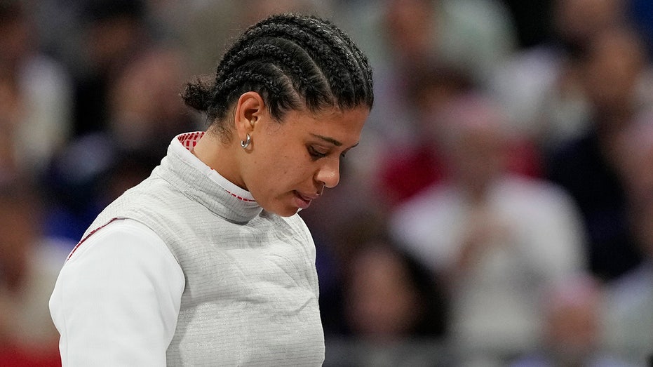 French Olympic fencer's kiss contamination defense holds up in court as she's cleared of doping violation Internet InfoMedia french olympic fencers kiss contamination defense holds up in court as shes cleared of doping violation