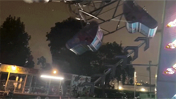 Internet InfoMedia carnival ride passengers left dangling in carriage after malfunction at high school event video